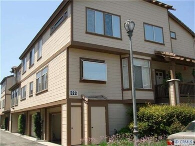End unit with attached 3 car garage