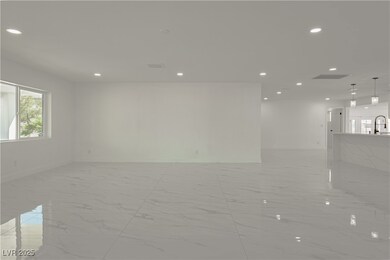 Spare room with light marble finish flooring, rece