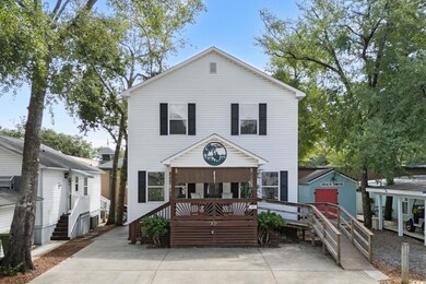 View of front of home with an outbuilding