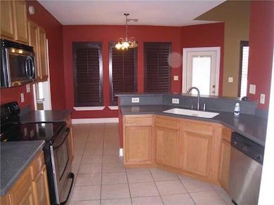 Kitchen. SOLID SURFACE COUNTERS, RIMLESS SINK,STAI