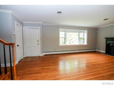 Formal living room with picture window, woodburnin