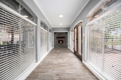 Bright entryway lined with windows, offering seren