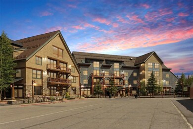 View of property at dusk
