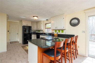 The kitchen features tiled floors,...