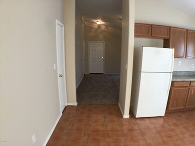 front door and kitchen