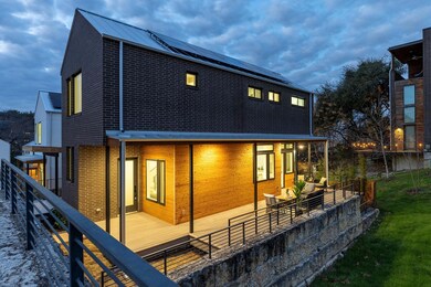 Rear view of house with roof mounted solar panels