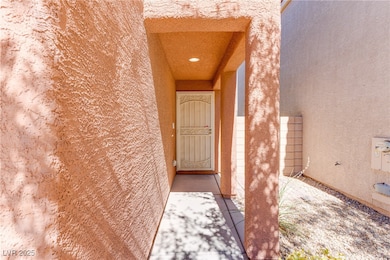 Property entrance with stucco siding
