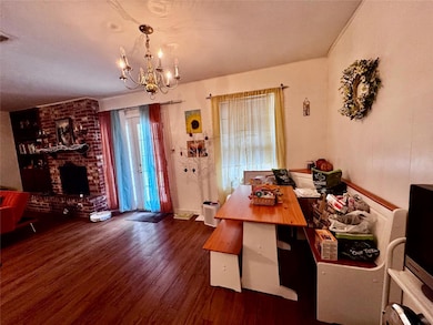 Dining space featuring visible vents, a brick fir