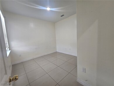 Unfurnished room featuring tile patterned flooring