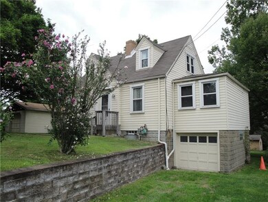 Home has integral and detached garages...