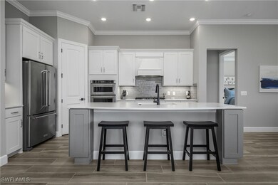 Well appointed kitchen features soft touch 