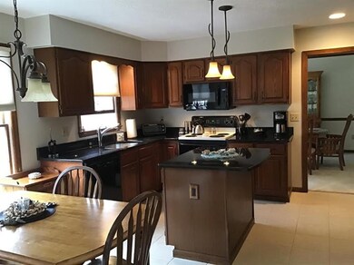 Granite counters complement the kitchen cabinetry.