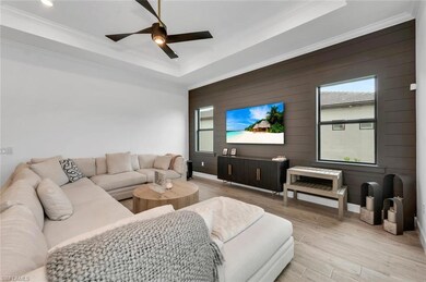 Living room with crown molding, a healthy amount o