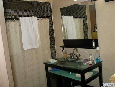 Shower redone with glass tiles, double modern sink