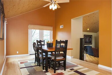 This dining room is spacious enough for all your parties and guests and features the beadboard vaulted ceiling and a wonderful bar area.