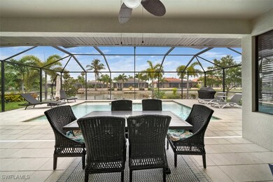 View of patio featuring a lanai and ceiling fan