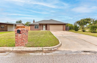 Single story home with concrete driveway, brick siding, a chimney, and a garage