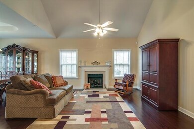 Open floor plan with vaulted ceilings and new solid wood bamboo flooring. Gas log fireplace!
