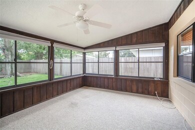 Florida Room surrounded by windows.