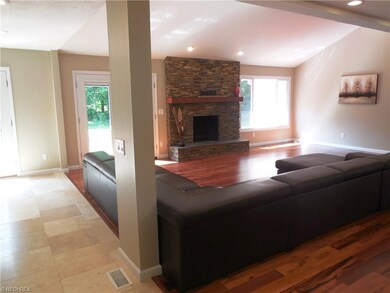 TRAVERTINE TILE IN KITCHEN INTO GREAT ROOM.