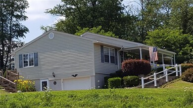 Vinyl sided with shutters, featuring a basement wa