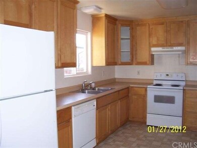 Kitchen with vinyl flooring, stove, dishwasher, re