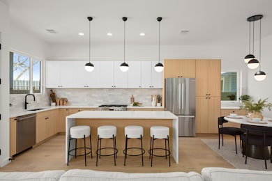 Kitchen featuring appliances with stainless steel