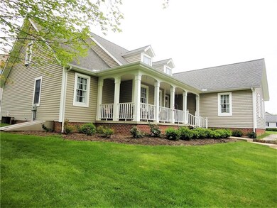 Corner view showing porch and walkout basement access