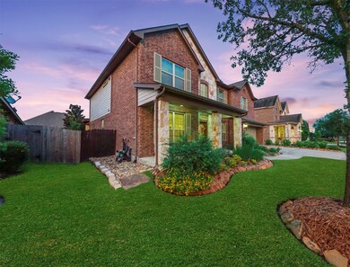 Meticulous professional landscaping frames the beautiful exterior.