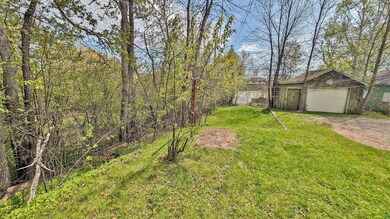 View of yard with a garage