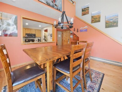 Dining room with a chandelier, recessed lighting,