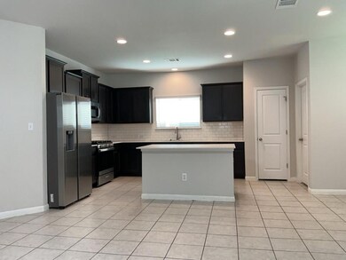 Kitchen featuring stainless steel appliances, bac
