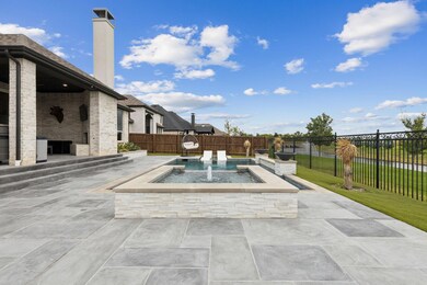 View of swimming pool with a patio area, a yard, a