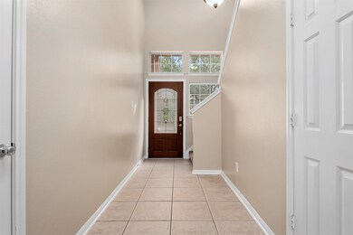 2-story entry with tile floors and a half bathroom
