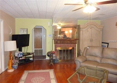 Living Room with wood-burning fireplace and wood f