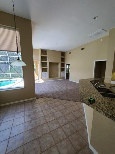 KITCHEN EATING SPACE LOOKING AT FAMILY ROOM