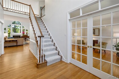 Front staircase, sitting room with French doors, h