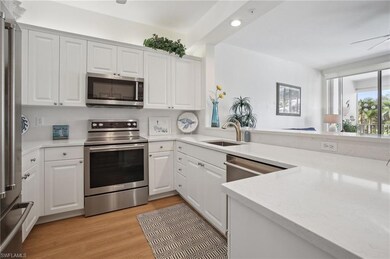 Kitchen with a ceiling fan, appliances with stainless steel finishes, white cabinetry, light wood finished floors, and recessed lighting