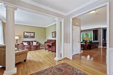 Foyer view to Living Room and Family Room.