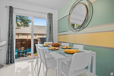Dining space featuring tile patterned floors and baseboards