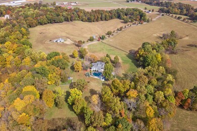 The aerial view captures the magic of the land. The estate features a 5 bedroom main home, a garage with a Carriage house above and a gorgeous pool/guest house for friends and family.