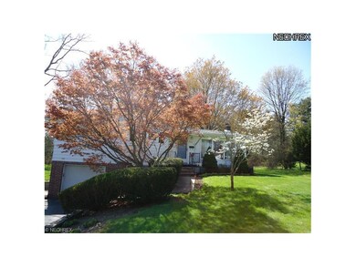 Asphalt driveway with turn-around.
