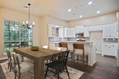 Dining space featuring a chandelier, sink, and dar