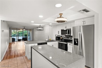 Kitchen featuring sink, kitchen peninsula, hanging