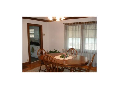 Dining room facing the adjacent kitchen.