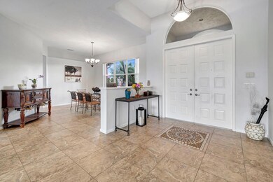 Formal dining room adds elegance to the open gathe