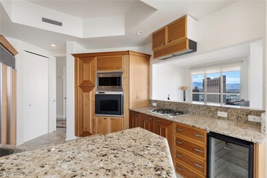 Kitchen featuring built in appliances, beverage co