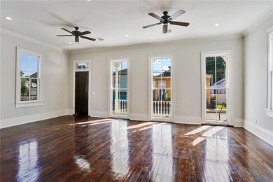 Living area with floor to ceiling windows that ope