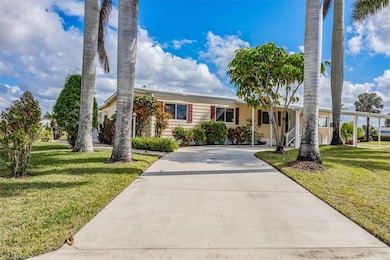 View of front of house featuring a carport and a f