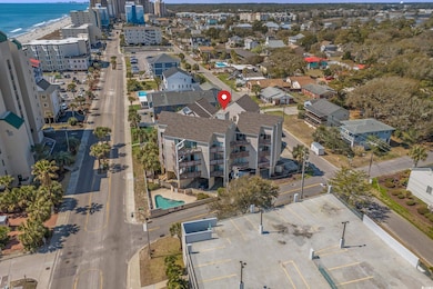 Birds eye view of property with a water view